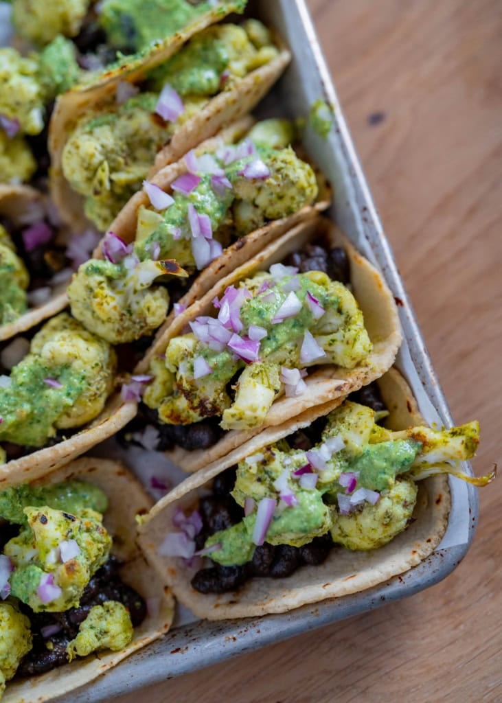 Black bean + cauliflower tacos with creamy chimichurri