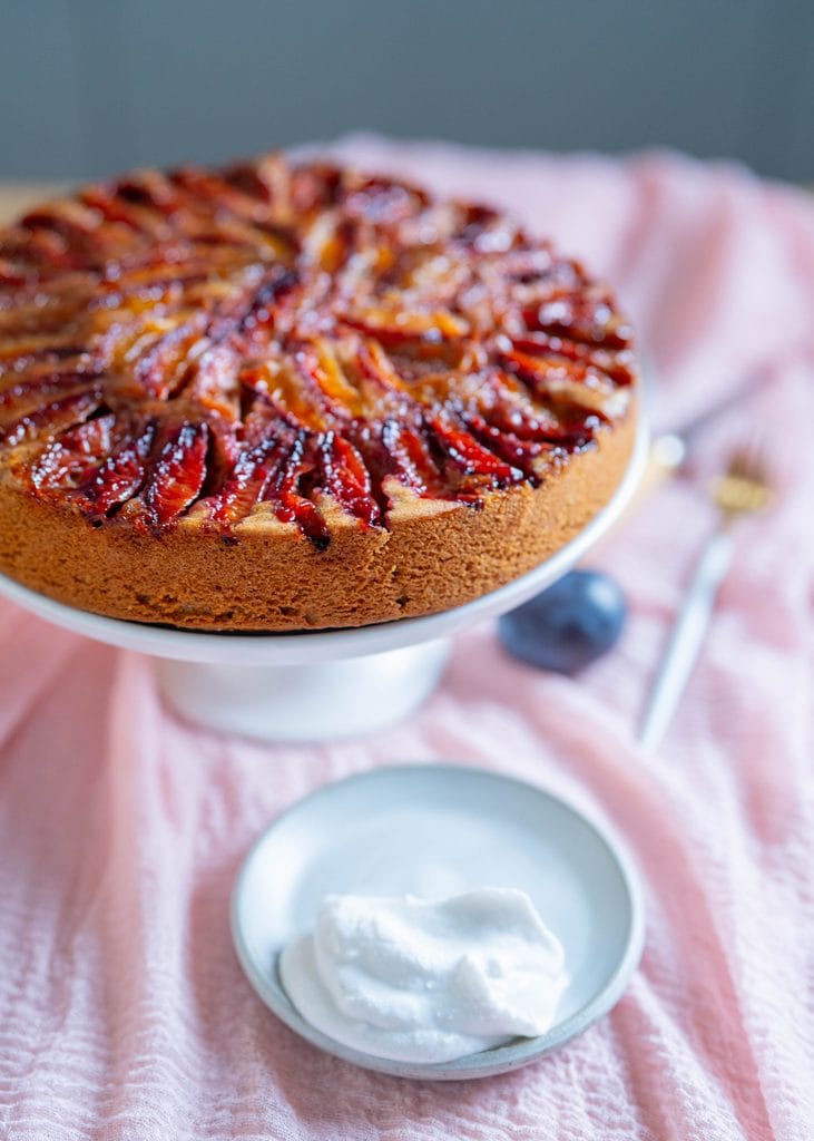 plum upside down cake with coconut whipped cream