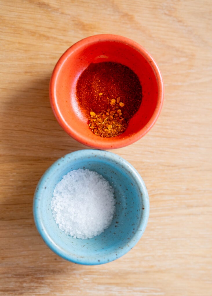 two bowls of salt, and paprika + chili flake