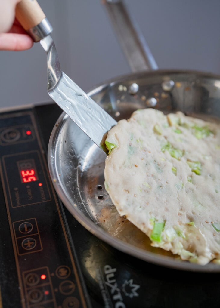 flipping crispy sourdough discard scallion pancake
