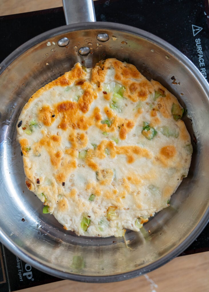 crispy sourdough discard scallion pancake in pan