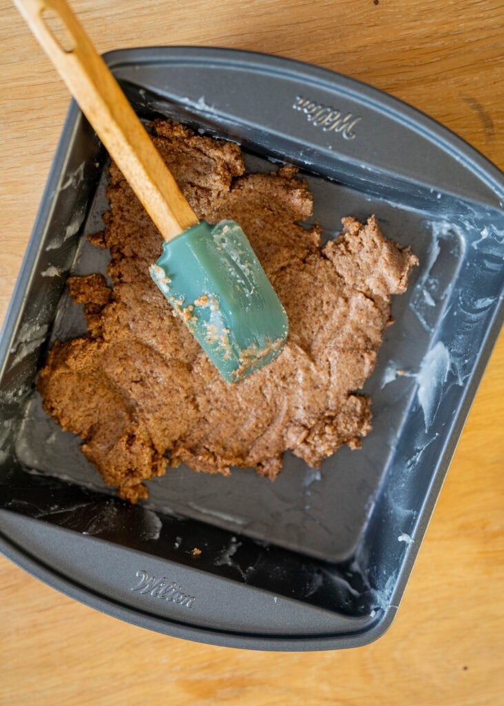 smoothing crust in pan