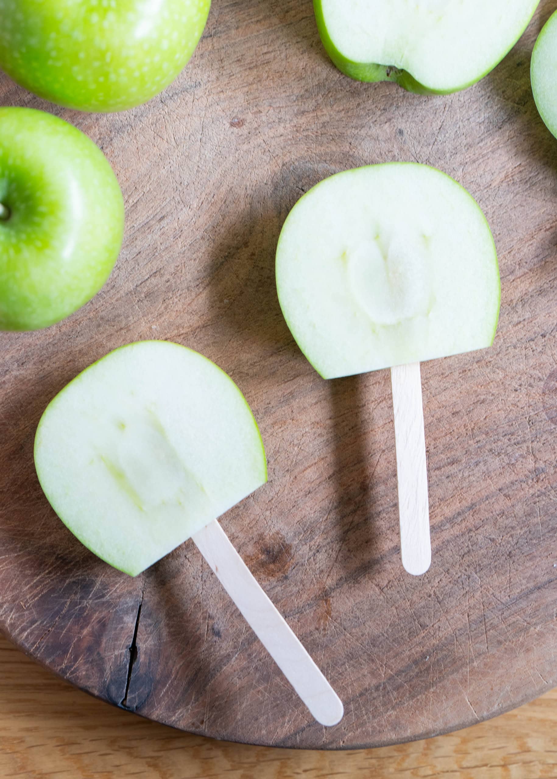green apples and popsicle sticks