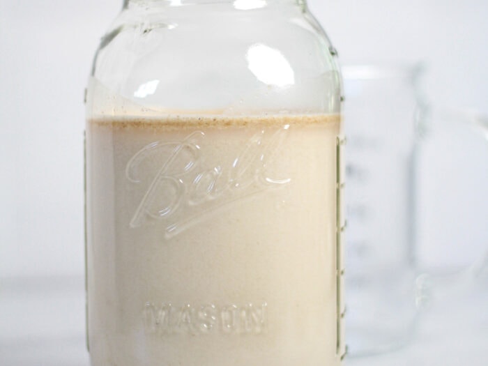 glass jar of homemade oat milk